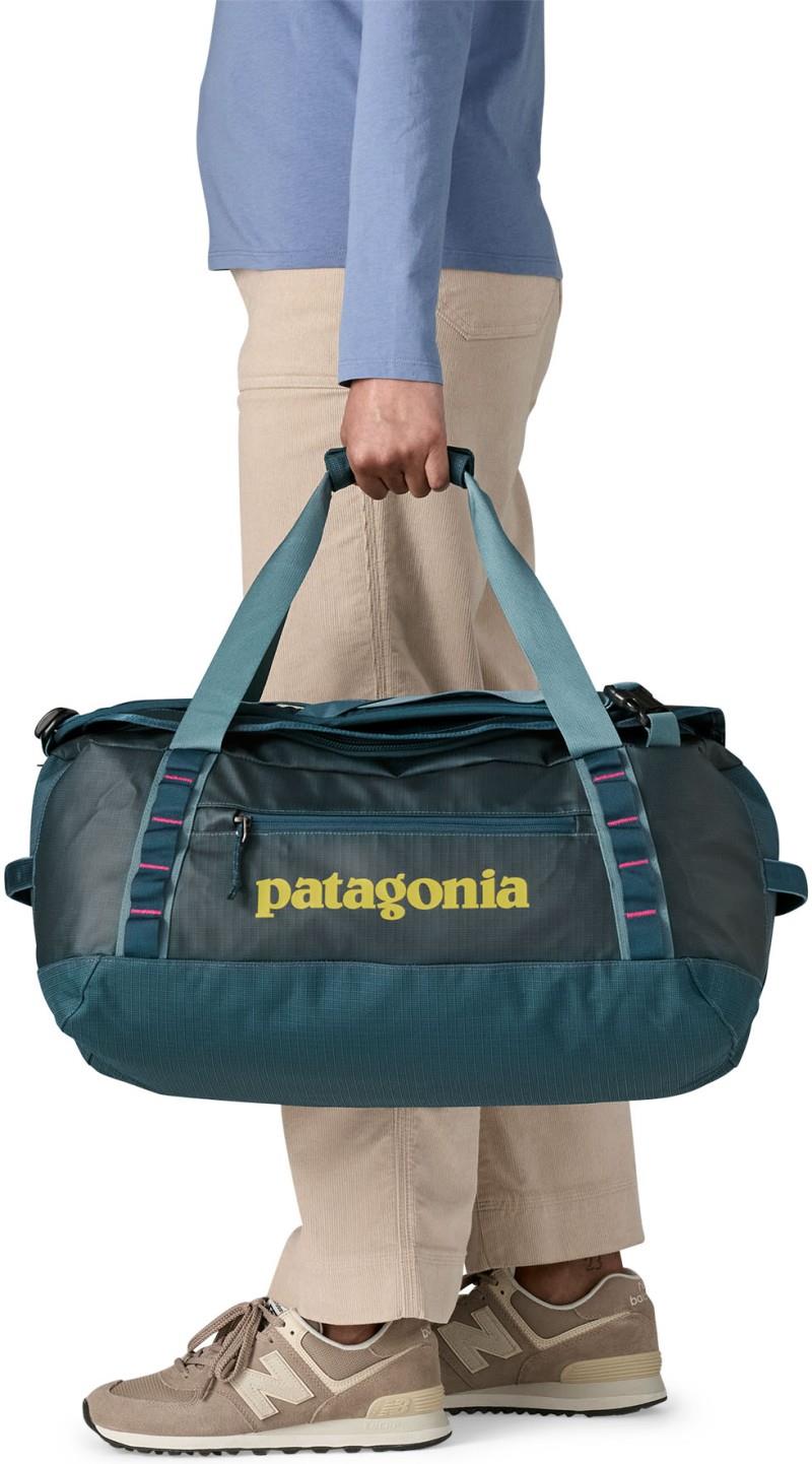 Black Hole Duffel 40L - tidal teal w/luminous pink 1