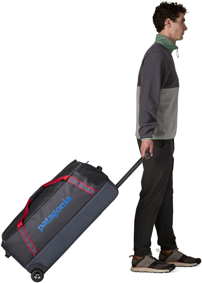 Black Hole Wheeled Duffel 100L - smolder blue w/amanita red 1