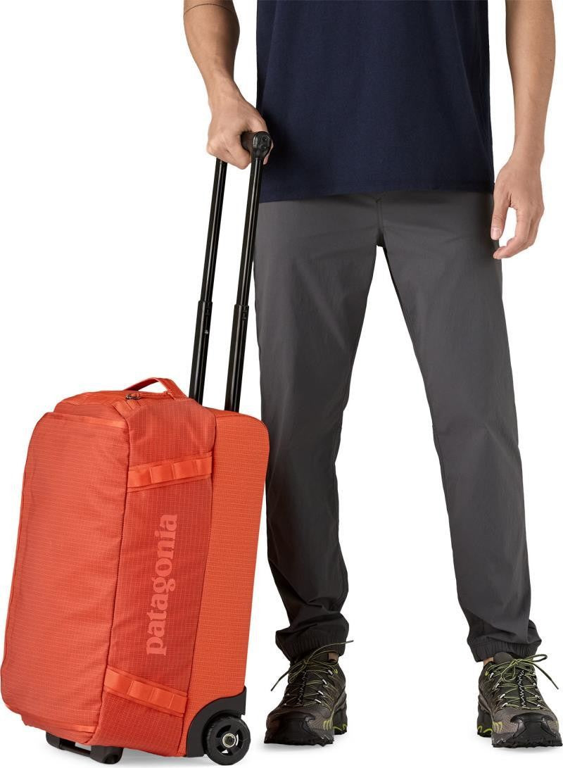 Black Hole Wheeled Duffel 40L - pollinator orange 1