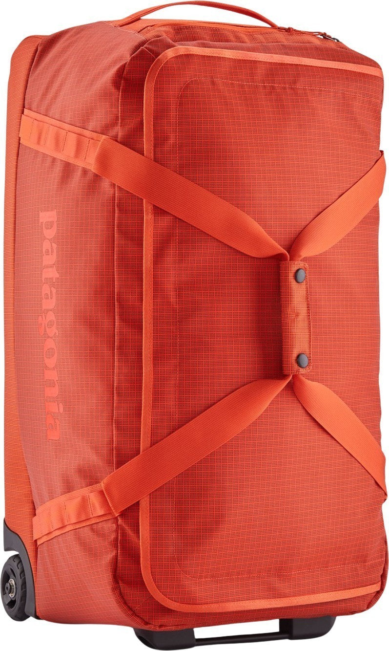 Black Hole Wheeled Duffel 70L - pollinator orange 1