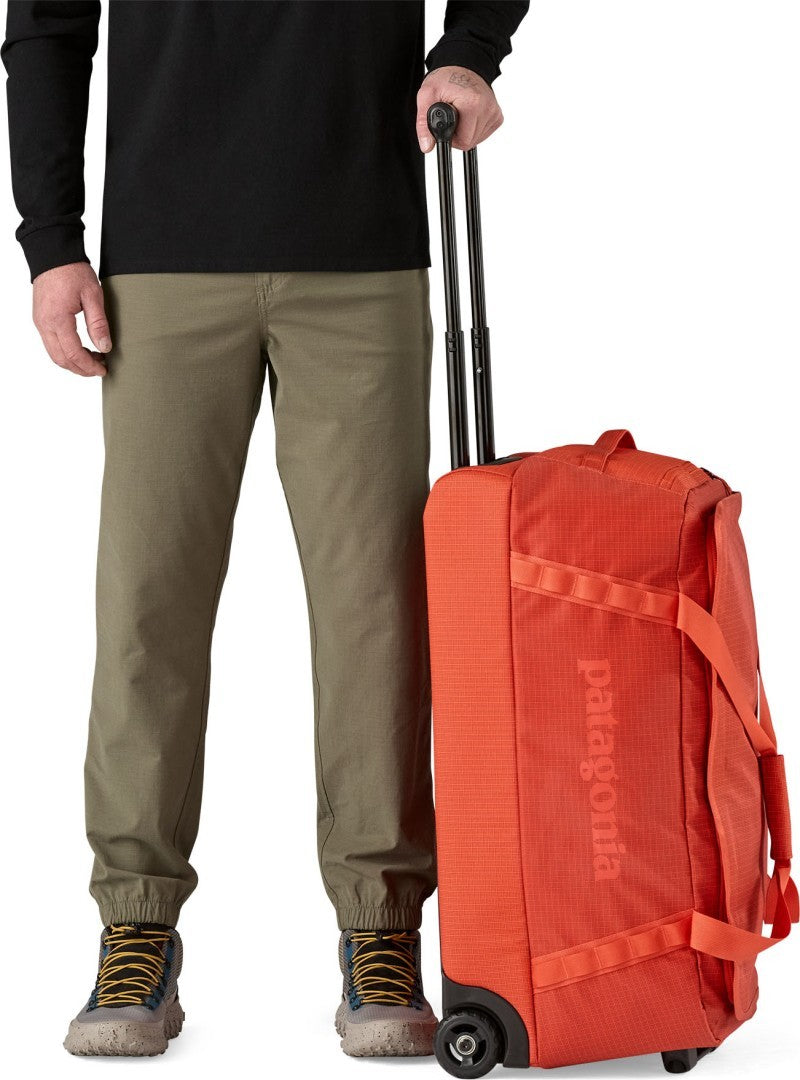 Black Hole Wheeled Duffel 70L - pollinator orange 1
